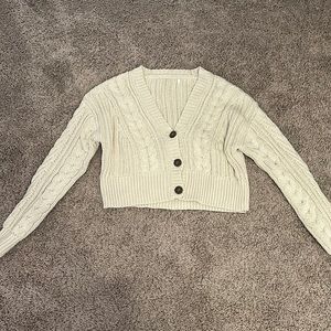 cream colored knit sweater in size xs/s